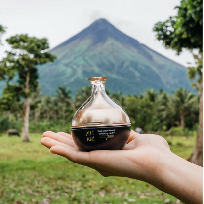 Pili Ani's Volcanic Ash Mask with Mayon Volcano in the background – Photo from Pili Ani